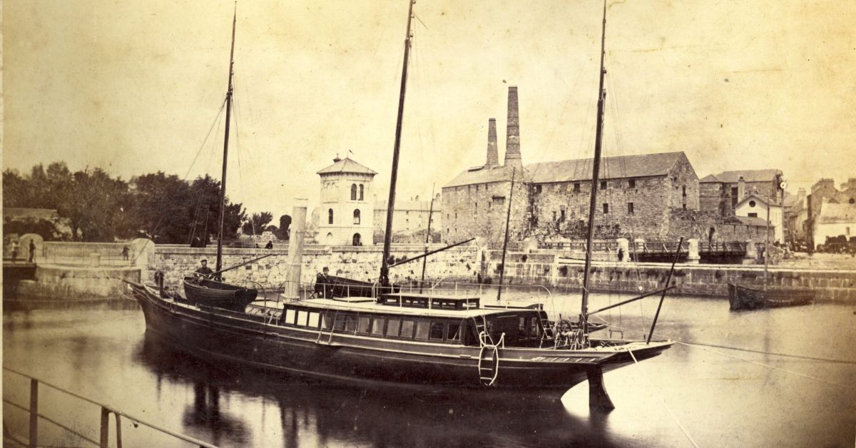 The-Claddagh-Basin-with-Fisheries-Tower-and-Burkes-Distillery-in-the-background-c.-1880.-Courtesy-of-Chethams-Library-Manchester-scaled-1.jpeg